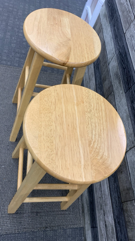 2 BLONDE WOOD STOOLS.