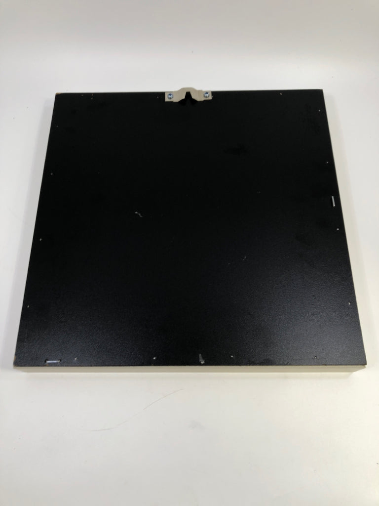 WHITE FLOWER IN GREY SHADOWBOX FRAME.