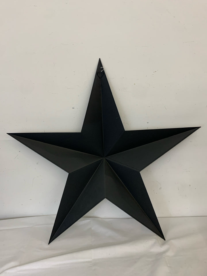 LARGE BLACK METAL 3D STAR WALL ART.