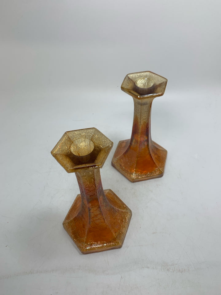 2 FOOTED MARIGOLD TEXTURED GLASS TAPERED CANDLE HOLDERS.
