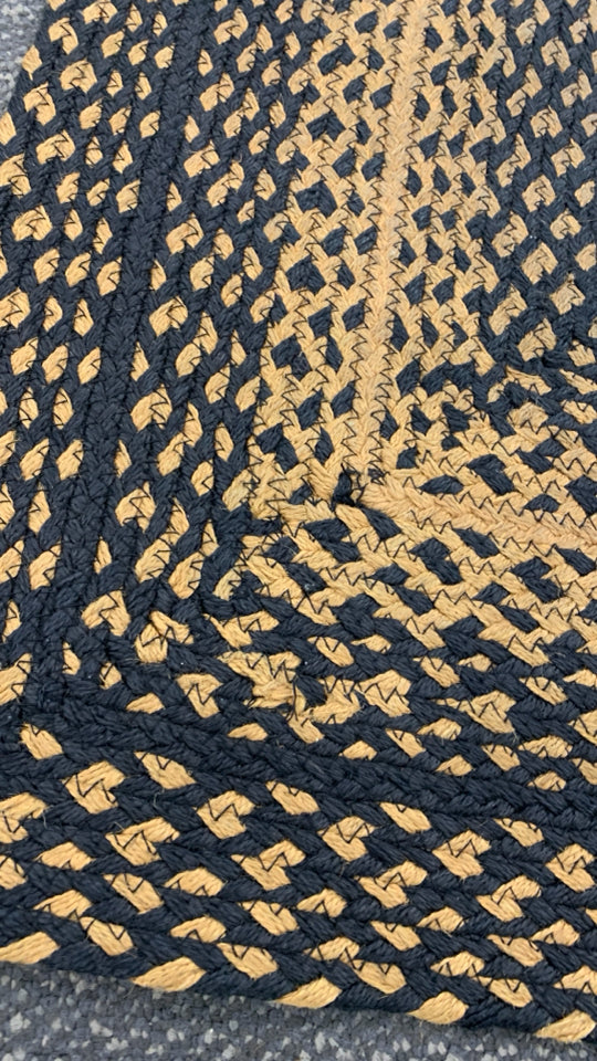 BLACK/BEIGE BRAIDED WOVEN  RUG.