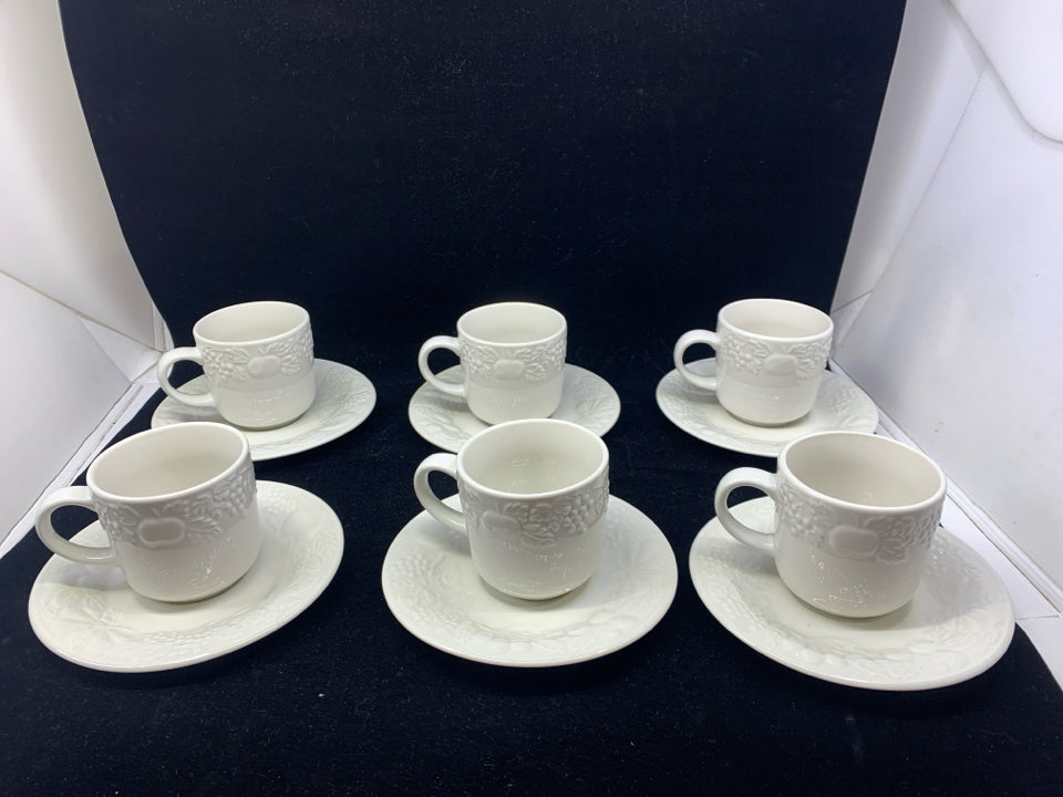 12 PC WHITE GIBSON EMBOSSED FRUIT TEACUPS AND SAUCERS.