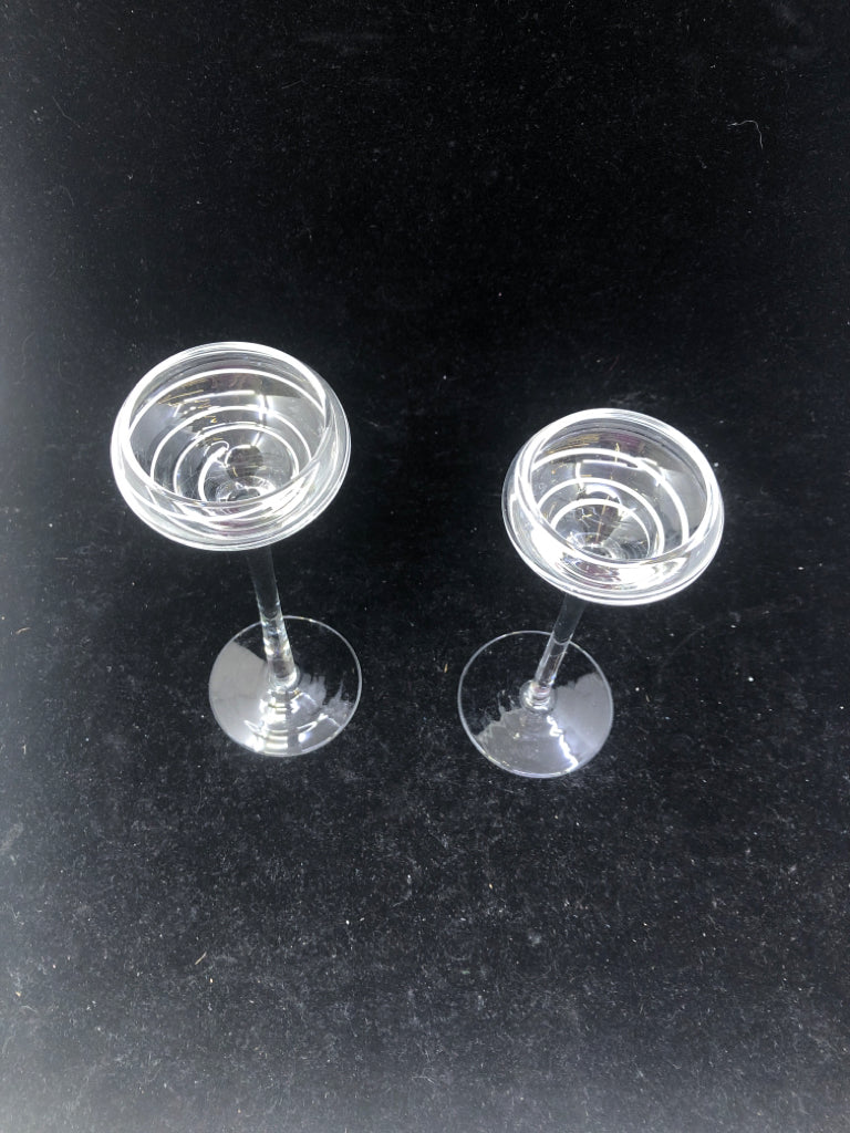2 FOOTED GLASS TEA LIGHT HOLDERS W/ WHITE SWIRL.