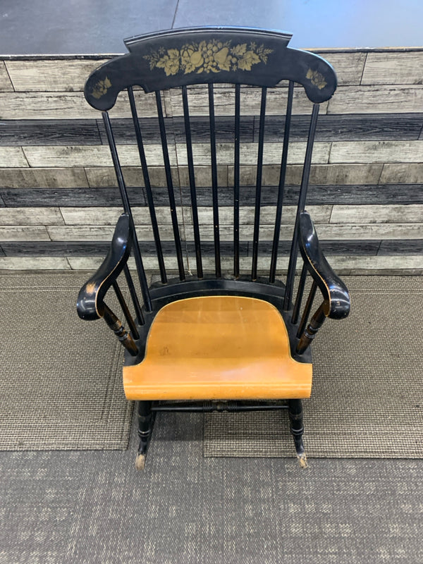 BLACK WOOD ROCKING CHAIR W FRUIT DETAILING.