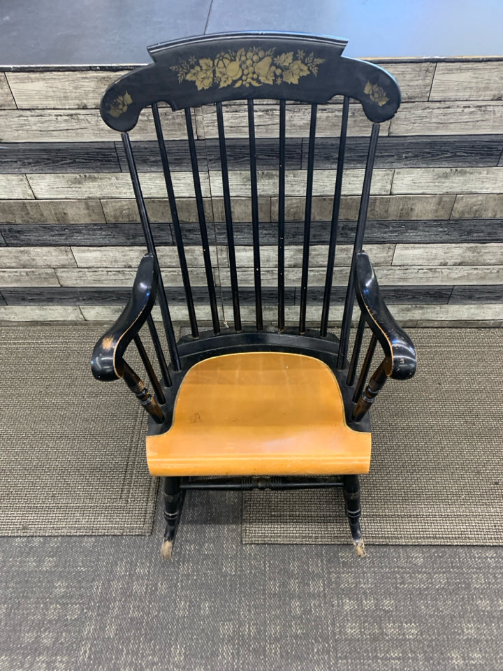 BLACK WOOD ROCKING CHAIR W FRUIT DETAILING.