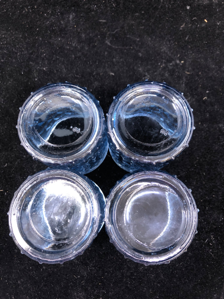 4 BLUE GLASS TEA LIGHT CANDLE HOLDERS.