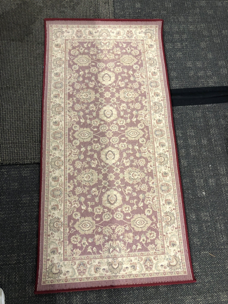 RED AND FLORAL ORIENTAL RUG.