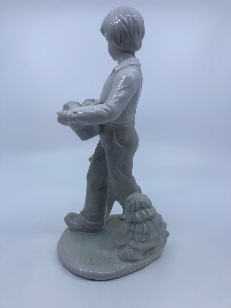 BOY W/DOGS PORCELAIN FIGURINE.