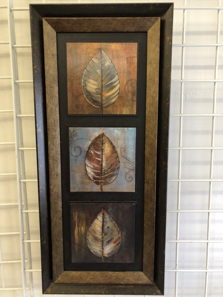 WOOD PAINTED LEAVES IN BROWN FRAME.