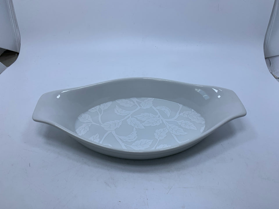 OVAL BAKER W/ HANDLES LEAF ON BOTTOM.