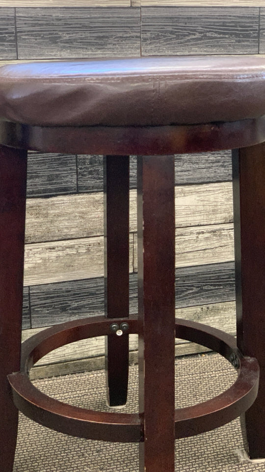 DARK WOOD ROUND STOOL W FAUX LEATHER SEAT.