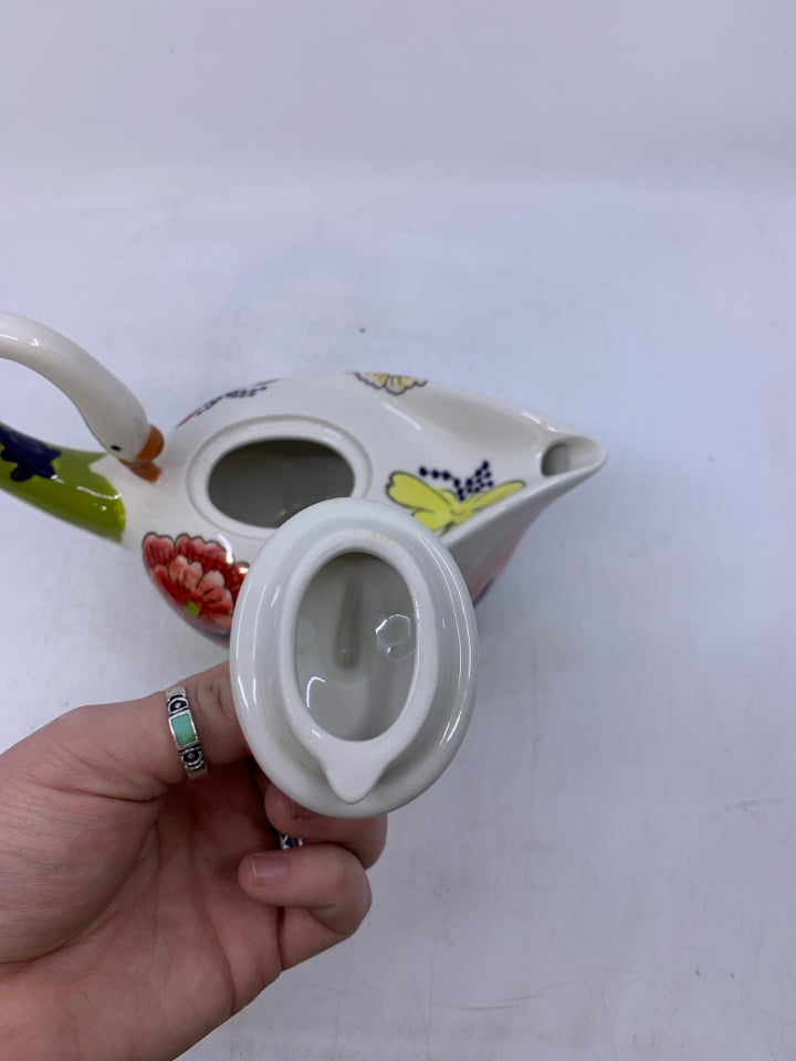 SWAN SHAPED W/ COLORFUL FLOWERS.