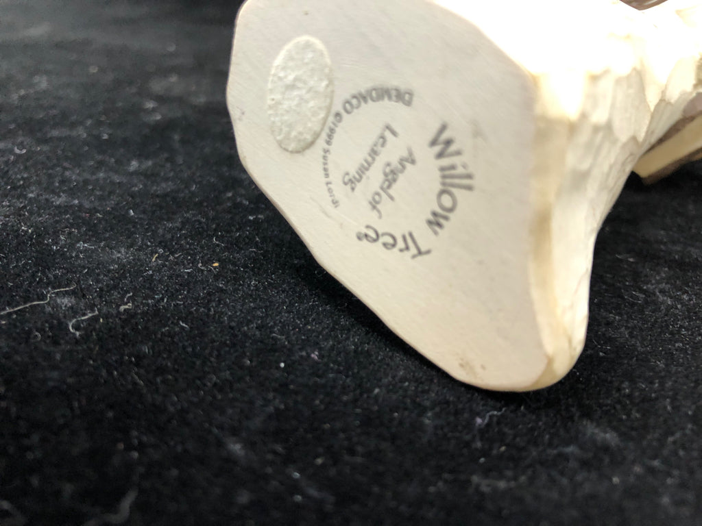 GIRL HOLDING BOOK ANGEL OF READING.