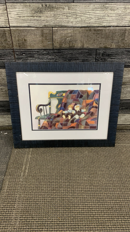 QUILT AND DOLLS PRINT IN BLUE WOOD FRAME.