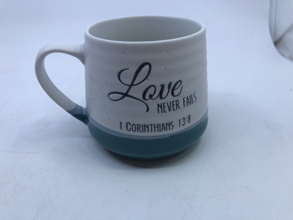 LOVE NEVER FAILS WHITE AND TEAL MUG.