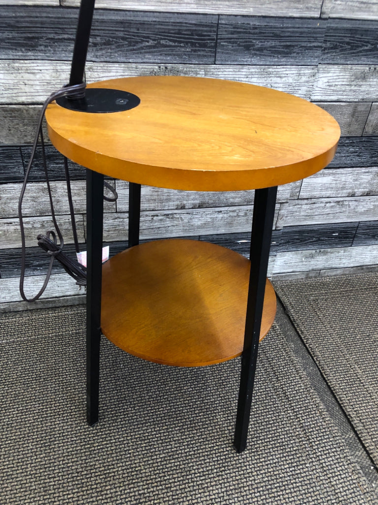BLONDE WOOD TABLE W ATTACHED LAMP AND OUTLET.