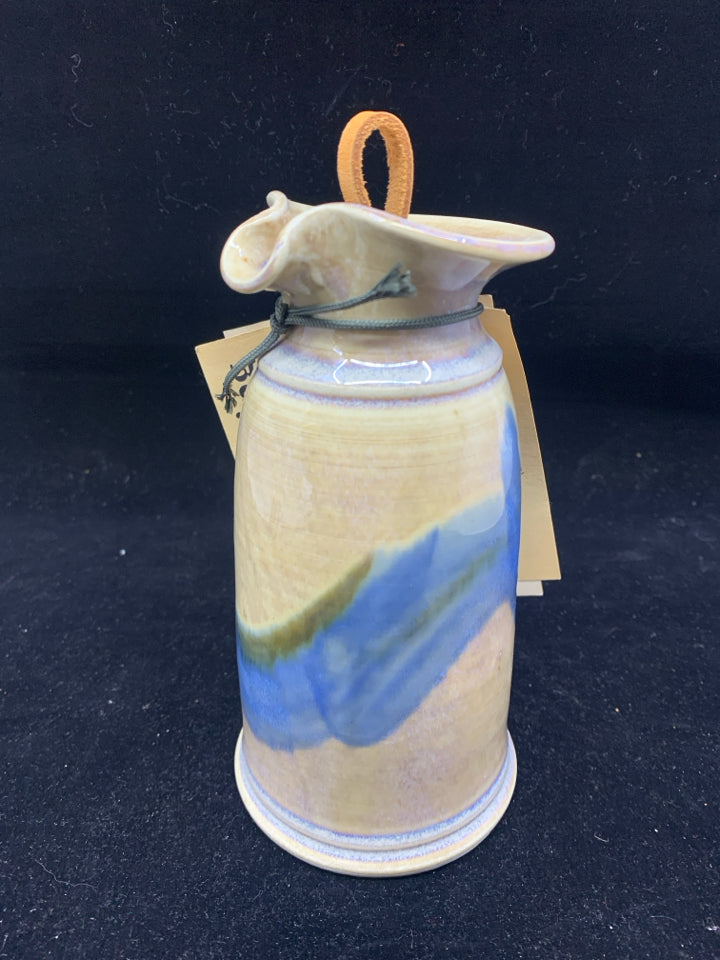 BLUE AND CREAM POTTERY DRESSING DISPENSER.