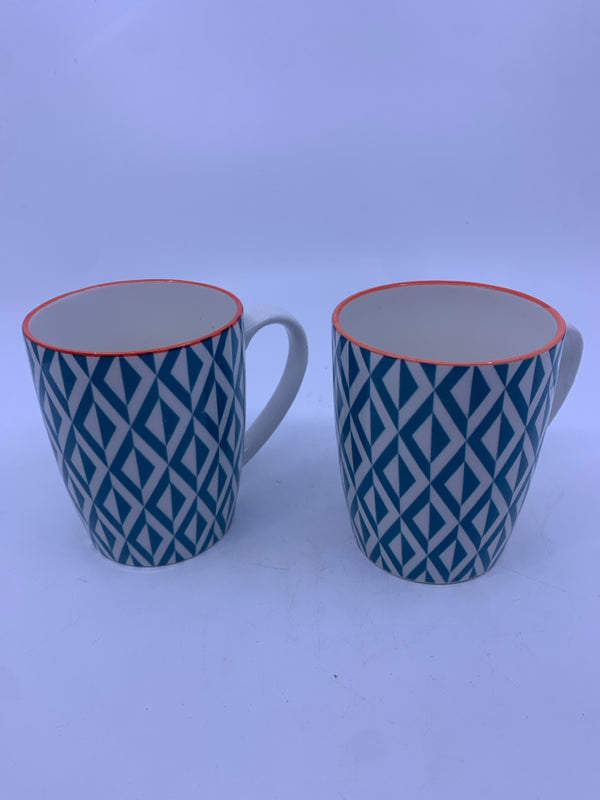 2 TEAL W ORANGE RIM MUGS.