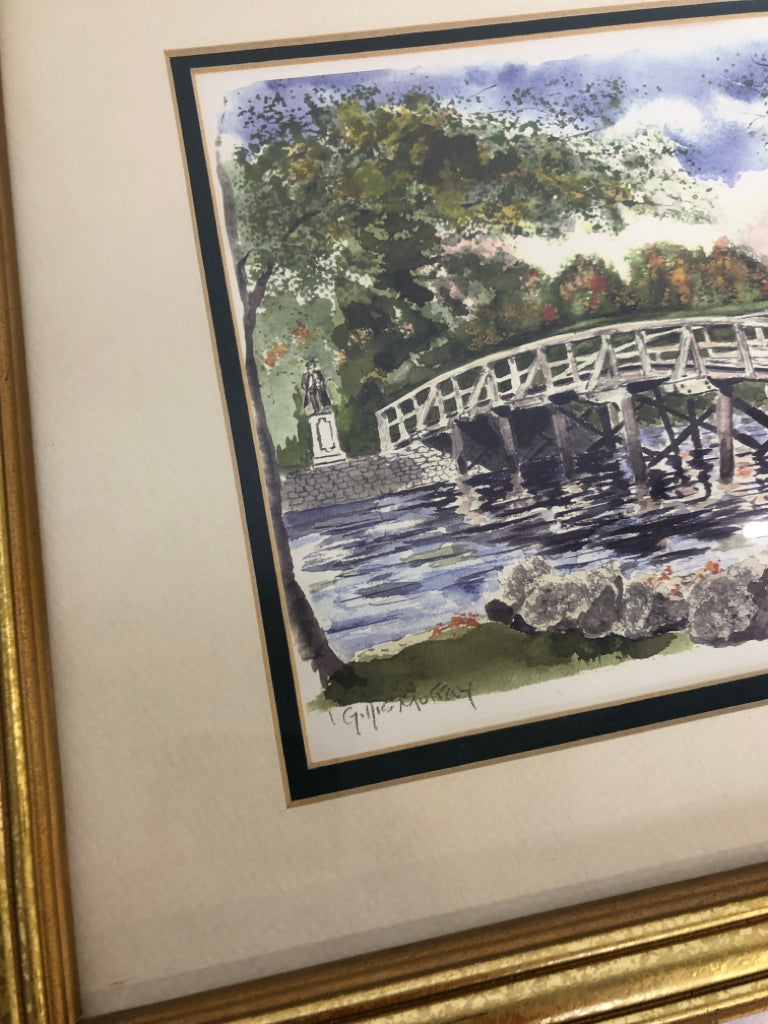 PAINTED BRIDGE SCENE W/ GREENERY SIGNED IN GOLD FRAME.