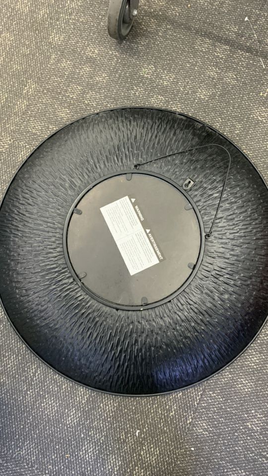 LARGE ROUND METAL MIRROR.