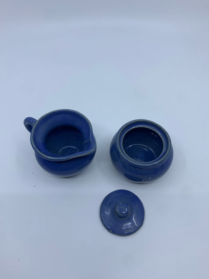 SMALL BLUE POTTERY CREAMER + COVERED SUGAR.