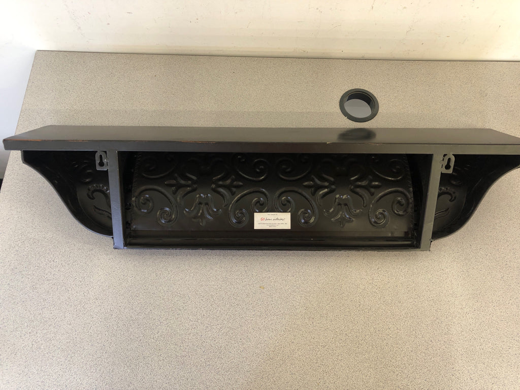 BLACK METAL SCROLL WALL SHELF W/ EMBOSSED DETAIL.