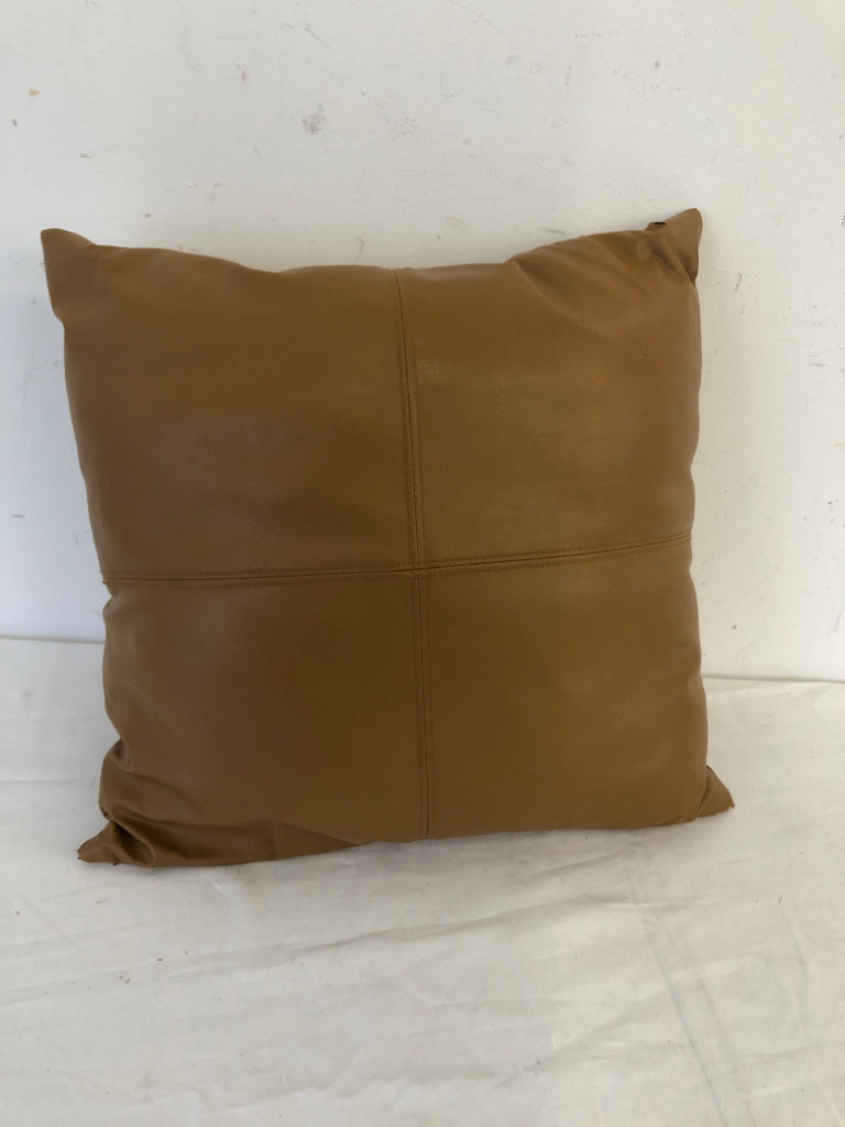 SMALL TAN FAUX LEATHER PILLOW.