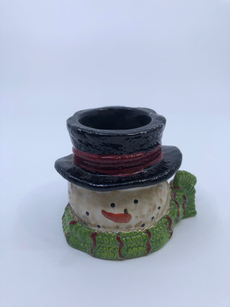 BROWN/WHITE SNOWMAN W GREEN SCARF CANDLE HOLDER.