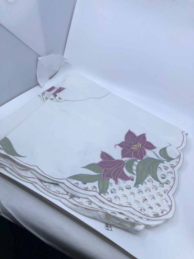 WHITE SQUARE TABLE CLOTH W/ PURPLE FLOWERS.