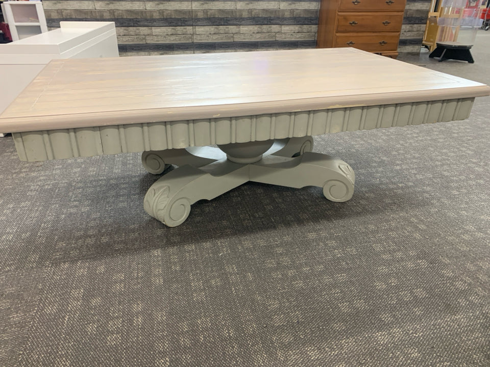 GREY WASHED COFFEE TABLE ON PEDESTAL BASE.
