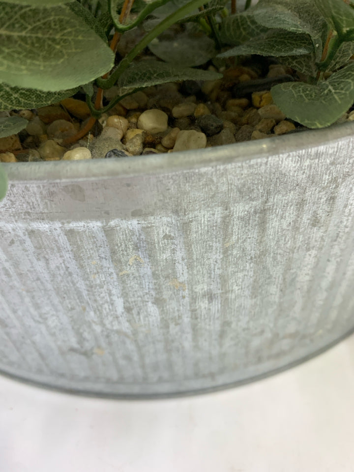 FAUX LEAVES & CREAM FLOWERS IN GALVANIZED TIN.