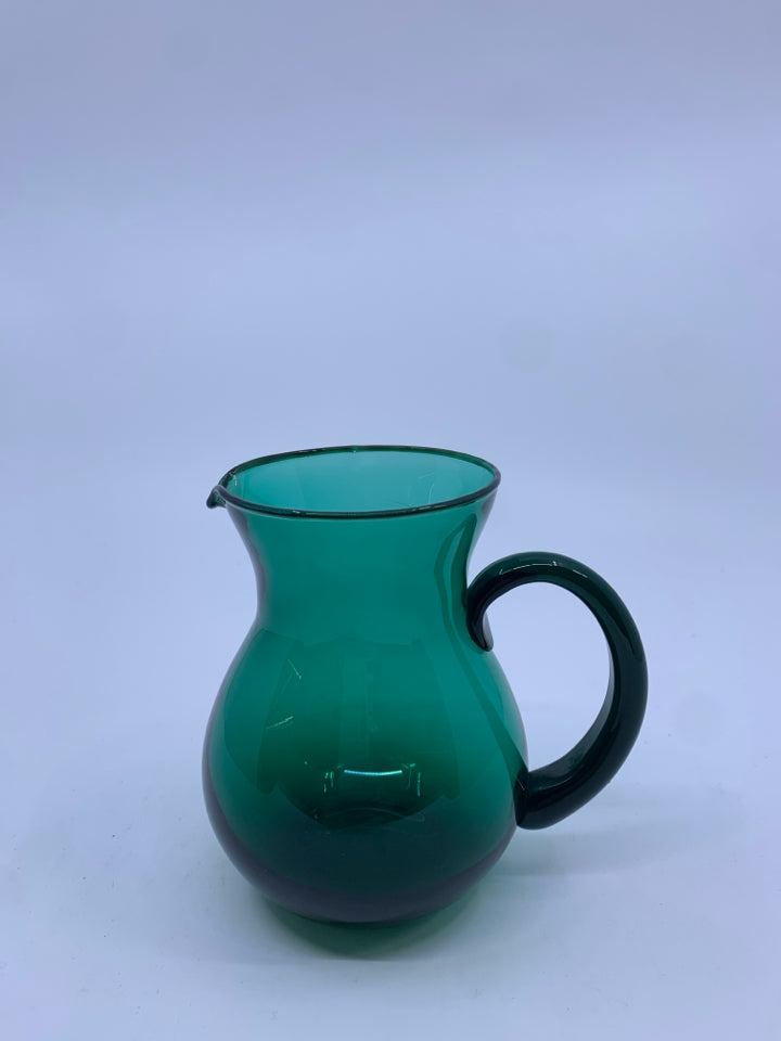 SMALL LIGHT GREEN GLASS PITCHER.