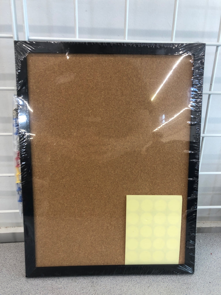 NIP CORK BOARD W/TACKS AND STICKERS.