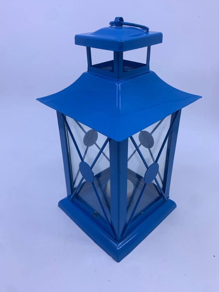 BLUE METAL TEA LIGHT LANTERN.
