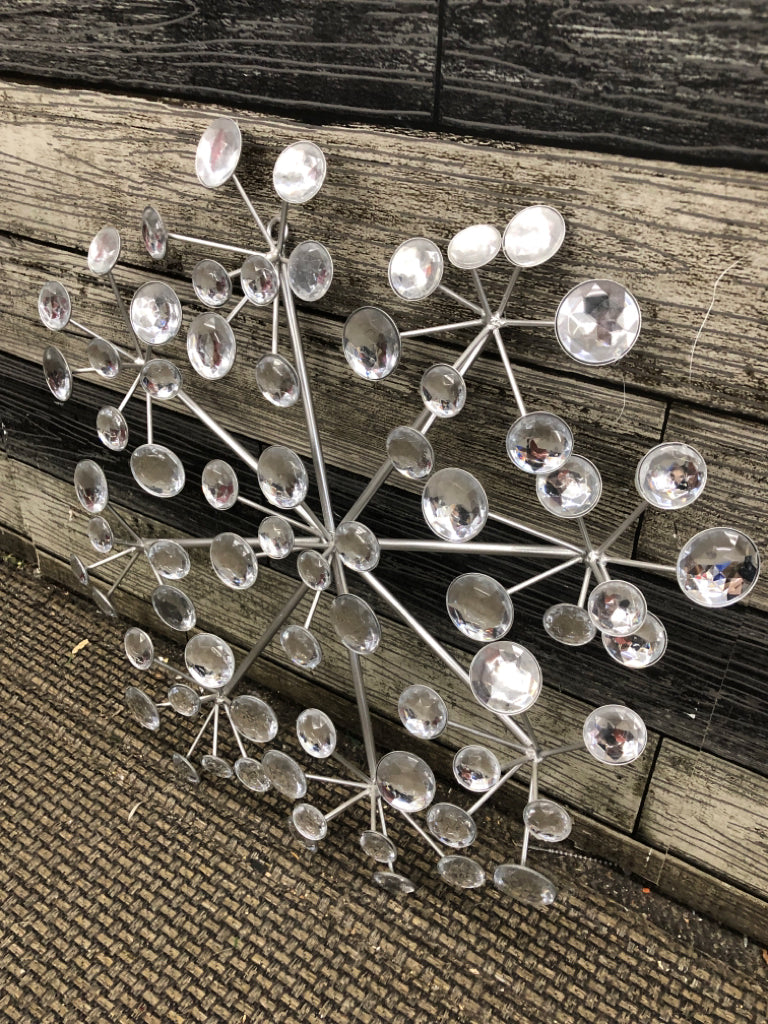 SILVER METAL STARBURST W/CRYSTAL EMBELLISHMENTS.