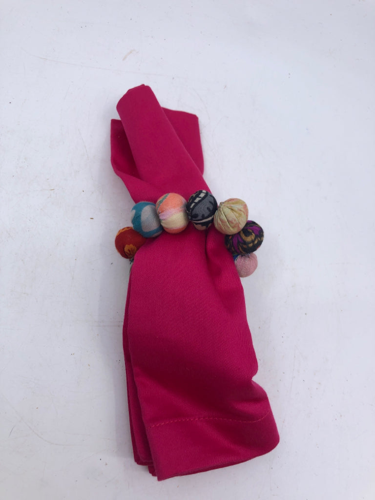 8 PINK NAPKINS W/ COLORFUL FABRIC NAPKIN RINGS CRATE & BARREL.