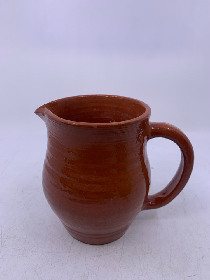 SMALL POTTERY PITCHER.