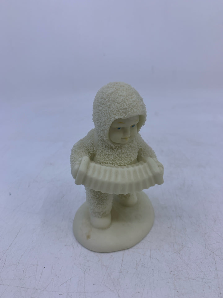 SNOW BABY HOLDING ACCORDION WALKING.