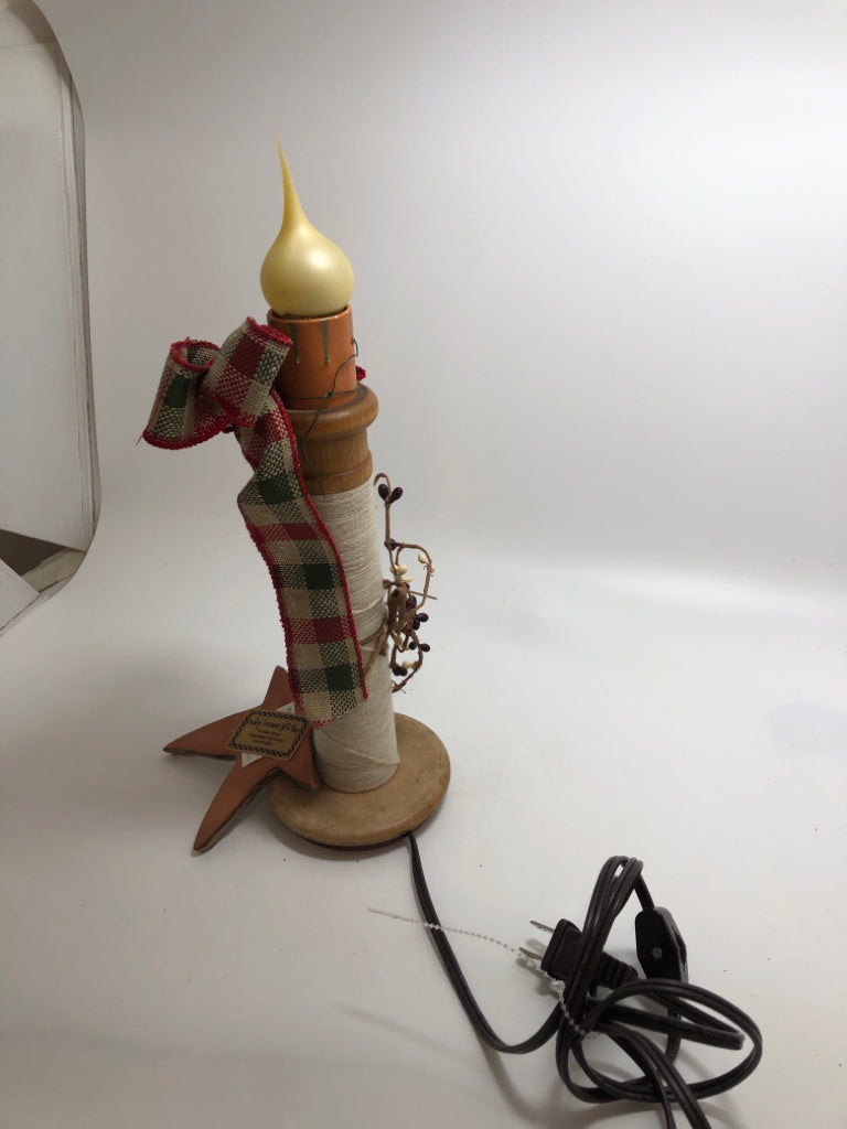 PRIMITIVE CHRISTMAS LIGHT UP CANDLE W/GREEN AND RED RIBBON.