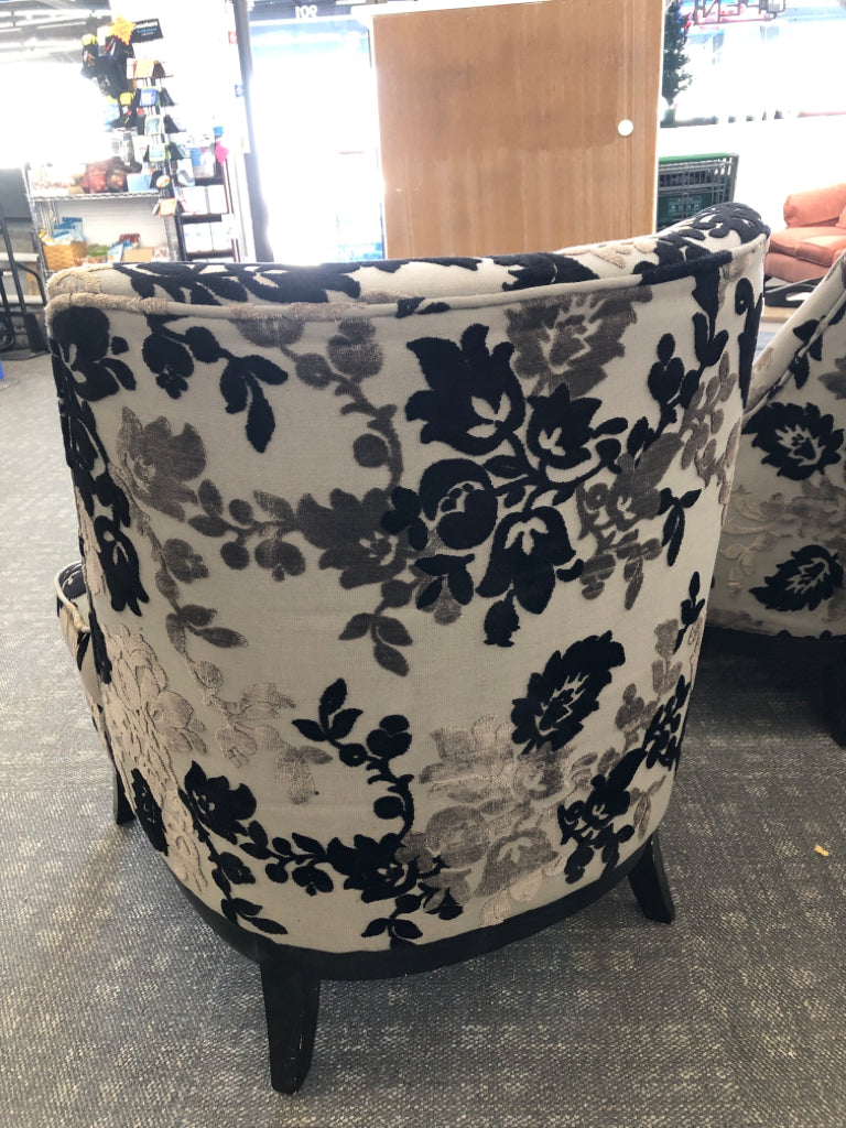 BLACK FLORAL UPHOLSTERED CHAIR W/ WOOD LEGS.