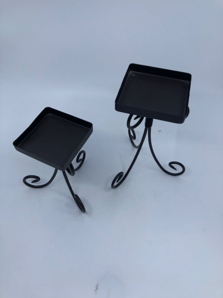 2 SQUARE BLACK CANDLE HOLDERS.