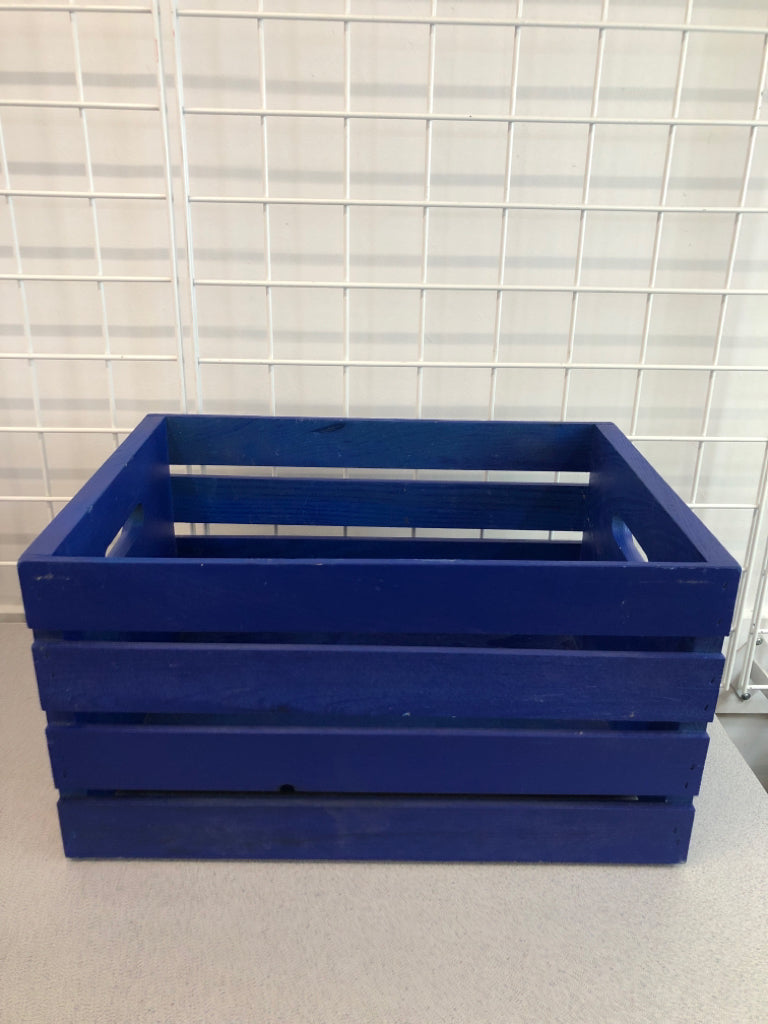 BLUE WOODEN CRATE.