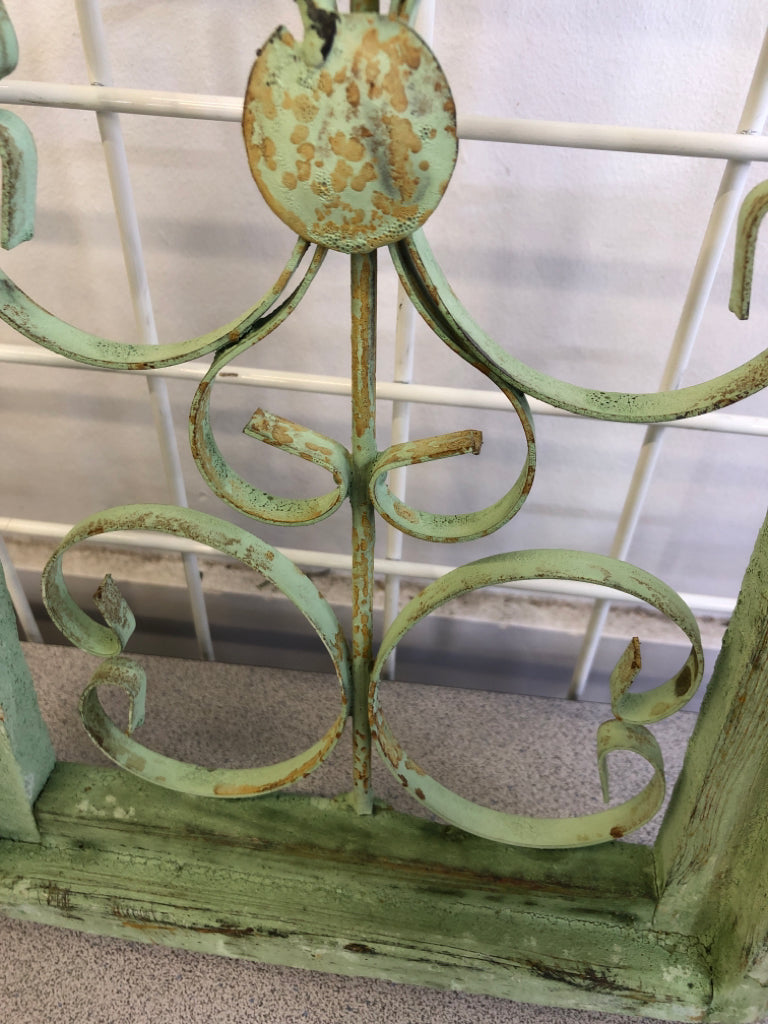 DISTRESSED GREEN PAINTED ARCH W/ METAL SCROLL WALL ART.