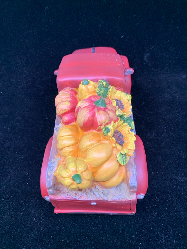 RED TRUCK WITH SUNFLOWERS AND PUMPKINS.