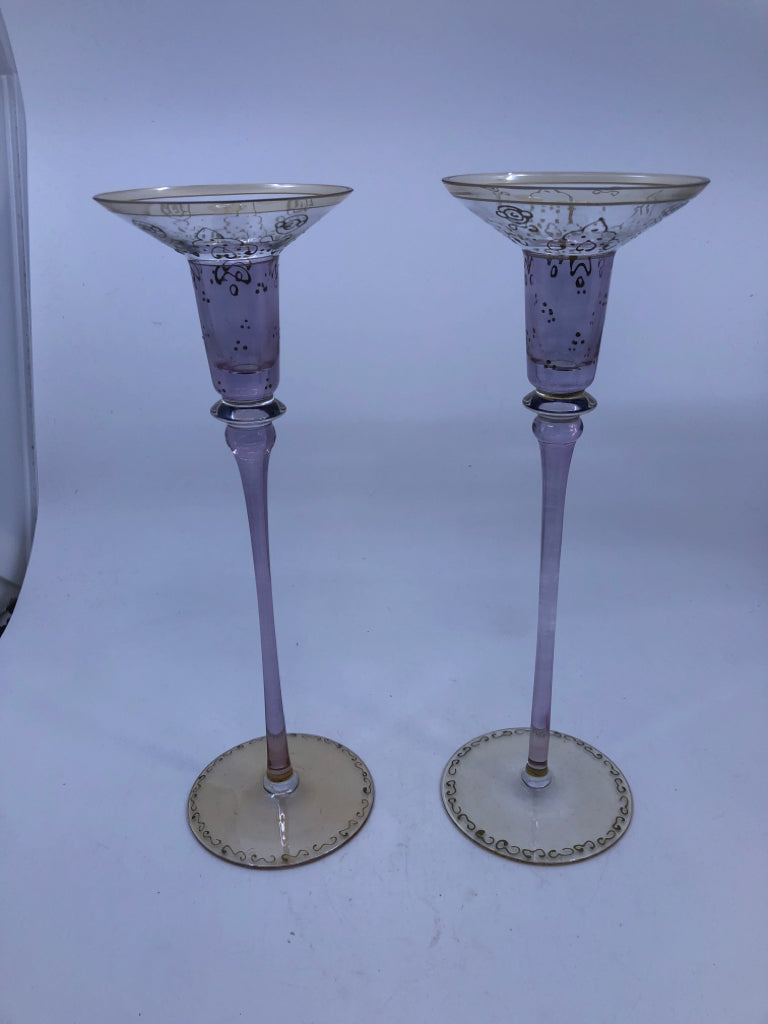 2 TALL GOLD AND PURPLE TAPER CANDLE HOLDERS.