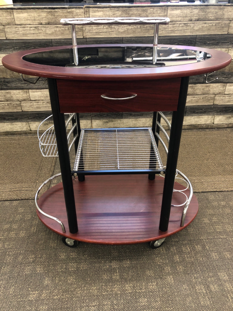 DK WOOD OVAL ROLLING BAR CART W/BLACK GLASS TOP.