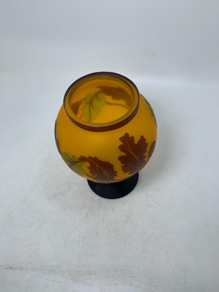 EMBOSSED ORANGE LEAVES/ACORN FOOTED VASE.