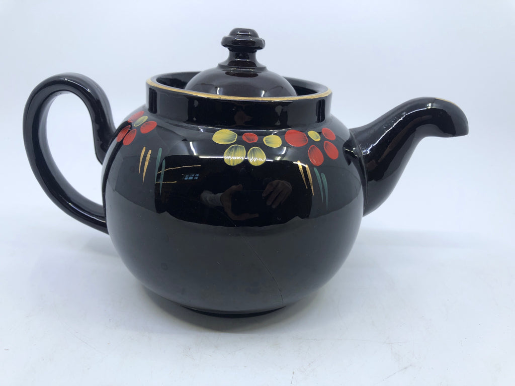 VTG BROWN CERAMIC TEAPOT W/RED & YELLOW FLOWERS.