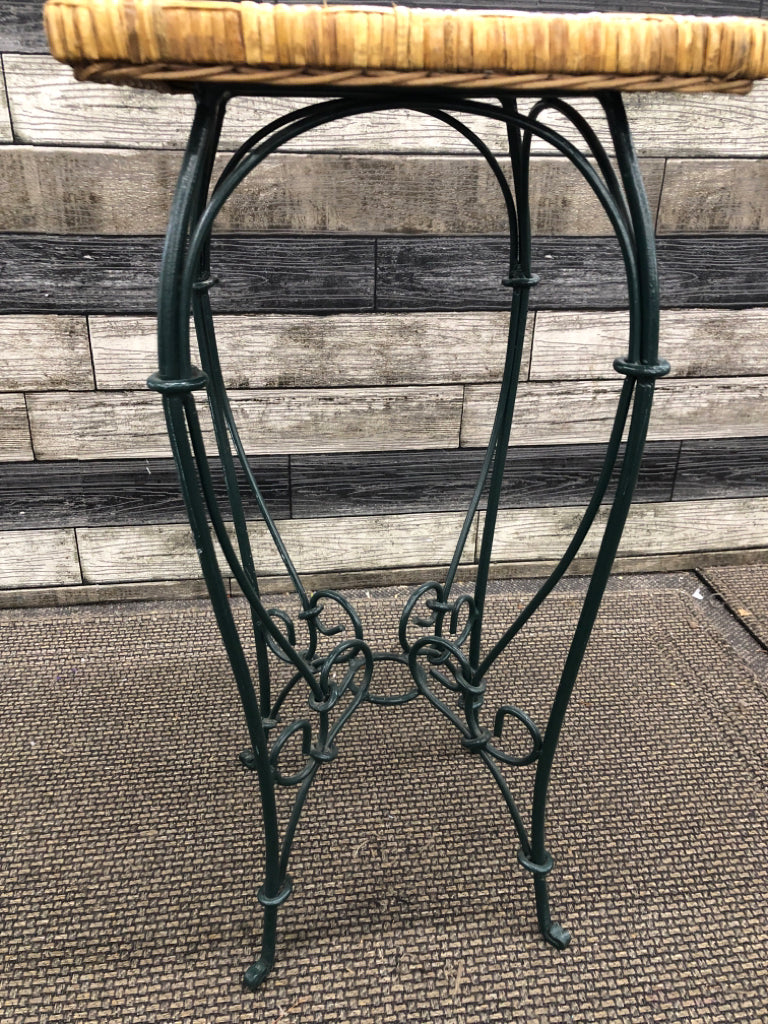 GREEN METAL WICKER PLANT STAND.