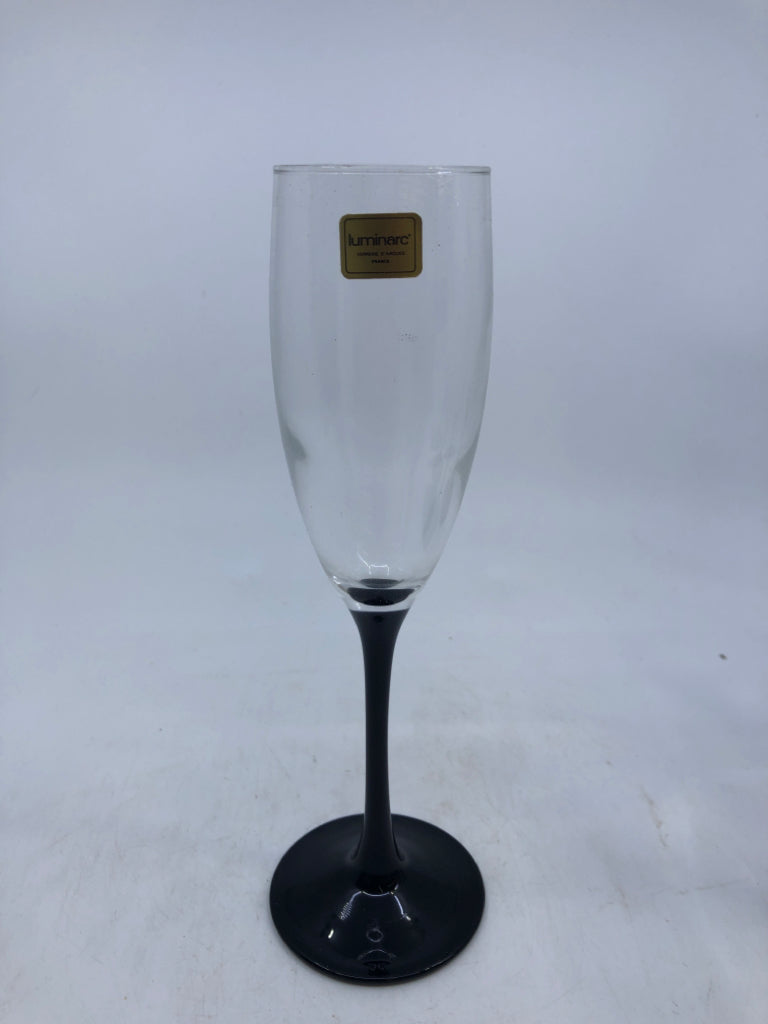 4 BLACK STEM CHAMPAGNE FLUTES W/BOX.